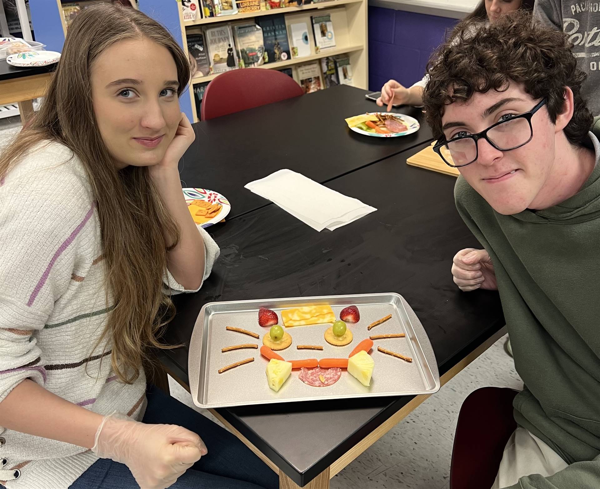 Students displaying their art project