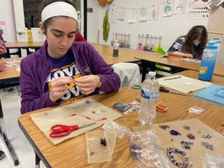 Emily working on jewelry