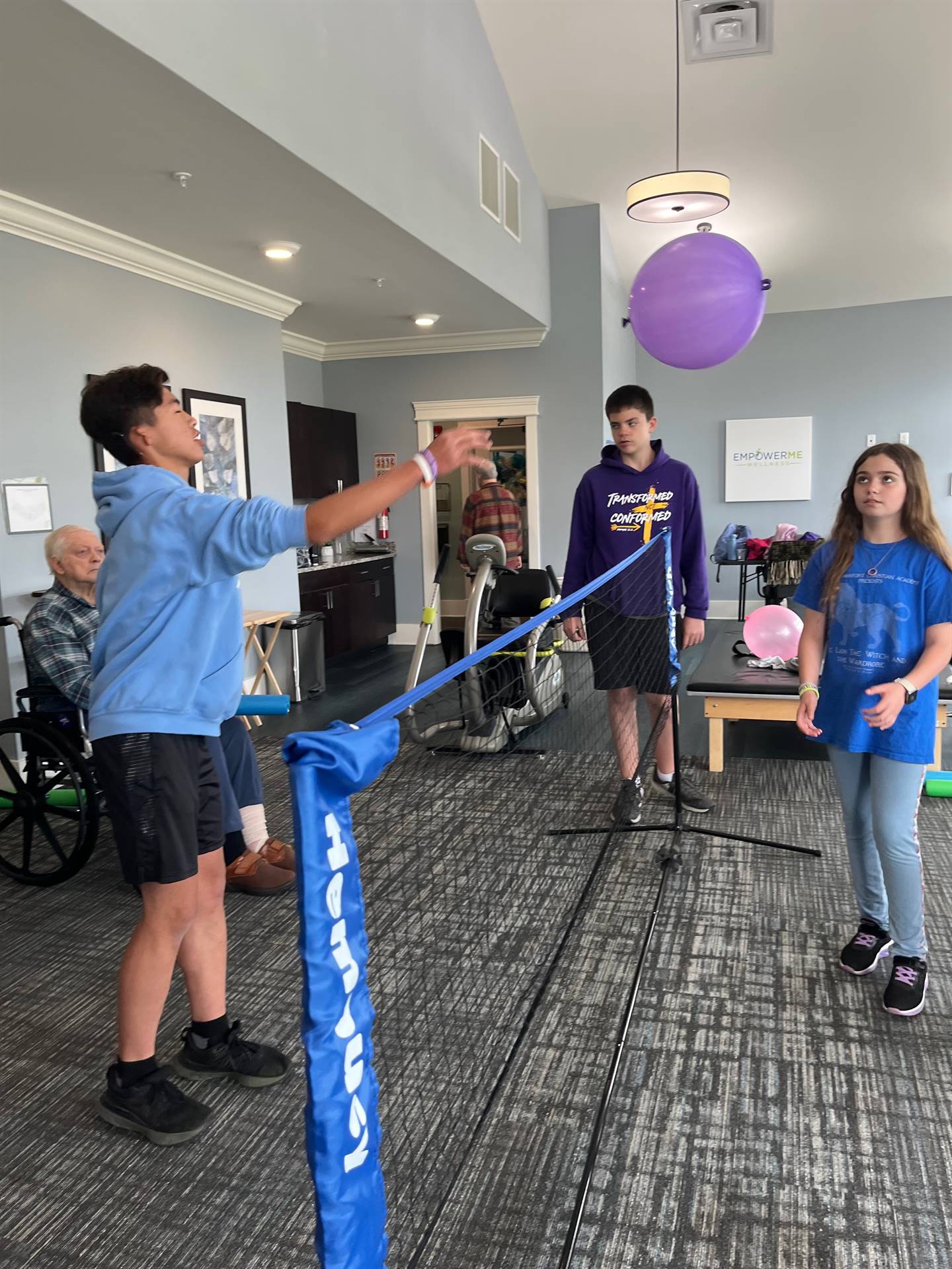 Students serving at a local assisted living home